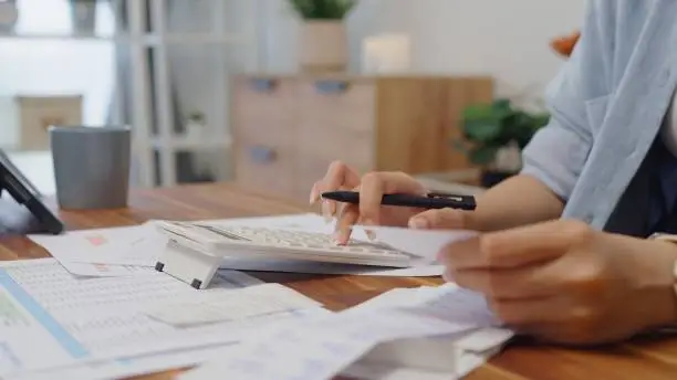 Real estate paperwork and home buying documents on desk